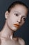 Beauty portrait of young women/girl with orange lipstick,white e