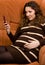 Beauty pregnant women reading sms