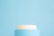 Beauty products background. Beige and blue cylinders on background with copy space. Podium stand, trendy minimal geometric scene