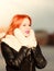 Beauty red hair woman in warm clothing outdoor