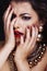 beauty rich brunette woman with a lot of jewellery, hispanic curly lady posing very emotional