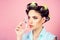 Beauty salon and hairdresser. Pin up girl. vintage housewife woman curl eyelashes with tool. retro woman with fashion