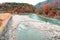 Beauty scenery clean green and blue water flow in canel rock from waterfall. Color leaves change tree on mountain. Landmark in jap