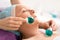 Beauty senior woman in beauty salon during treatment with a cold glass balls