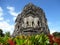 Beauty shot of Kalasan Temple Candi Buddhist temple at Central Java, historical landmark, carved stone walls, green grass plants