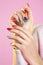 Beauty shot of model wearing colorful nail polish