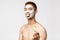 Beauty, skincare and spa concept. Portrait of funny naked asian man in cosmetics facial mask to treat acne, eating