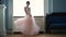 Beauty slowmotion - beautiful bride is spinning in a wedding dress