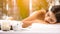 Beauty, spa, resort and relaxation concept - beautiful woman in spa salon