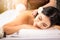 Beauty, spa, resort and relaxation concept - beautiful woman in spa salon