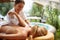 Beauty Spa Treatment-Smiling masseur is massaging a woman at spa