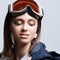 Beauty sport girl. Snowboard jacket. Pretty young woman in fitness clothes