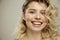 Beauty studio portrait of young happy optimistic cheery beautiful blonde  woman with perfect skin