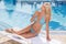 Beauty sunbathing. Attractive young women in bikini posing with
