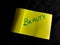 beauty text displayed on yellow paper slip isolated on dark background