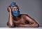 Beauty thatll stand out in a face-covering crowd. Shot of a beautiful young woman wearing a denim head wrap and mask.