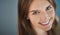 Beauty thats above par. High angle studio shot of an attractive young woman smiling against a gray background.