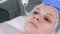 Beauty treatment facial electric darsonval therapy at cosmetology clinic.