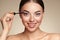 Beauty woman applying black mascara on eyelashes