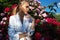 Beauty woman with bunch rose flowers