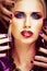 Beauty woman with creative make up, many fingers on face close u