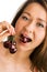 Beauty woman eat cherries