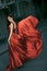 beauty woman in fluttering red dress