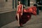 beauty woman in fluttering red dress