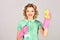 Beauty woman hold soup bottle, duster. Cleaning, retro style, purity. Housekeeper in uniform with clean spray. Retro