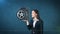 Beauty woman holding car tires on the open hand palm, over isolated studio background. Business and auto concept.