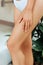 Beauty Woman legs in bathroom with smooth soft skin after hair removal. Laser epilation. Beauty and Body care Concept. Protection