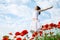 Beauty woman in poppy field