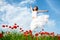 Beauty woman in poppy field