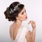 Beauty woman portrait. Wedding Hairstyle. Beautiful fashion bride girl model. Luxury jewelry. Manicured nails. Attractive young