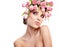 Beauty woman portrait with wreath from flowers on head over whit