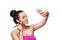 Beauty woman taking a selfie while putting make-up on