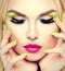 Beauty woman with vivid makeup and colorful nail polish