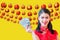 Beauty woman wear cheongsam and Hold a dollar chinese new year on yellow background