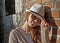 Beauty woman with white hat in a romantic alley