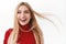 Beauty, women and fashion concept. Close-up portrait of lucky, successful blonde woman in red turtleneck, smiling and