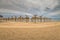 Beauty wooden umbrellas in empty sandy beach