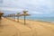 Beauty wooden umbrellas of empty sandy beach