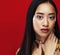 Beauty young asian girl with fashion make up on red background , beauty stylish look