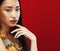 Beauty young asian girl with fashion make up on red background , beauty stylish look