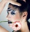 Beauty young woman with creative make up like zebra closeup, waves on face