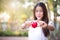 Beautyful asian young girl holding red heart
