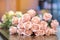 Beautyful bouquet of pink artificial roses placed on the table