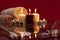 Beautyful burning light yellow creme vanilla candles and red with bright flame and towels natural color wine background