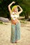 Beautyful hula hawaii dancer girl dancing on beach