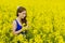 Beautyful teeny model in canola field